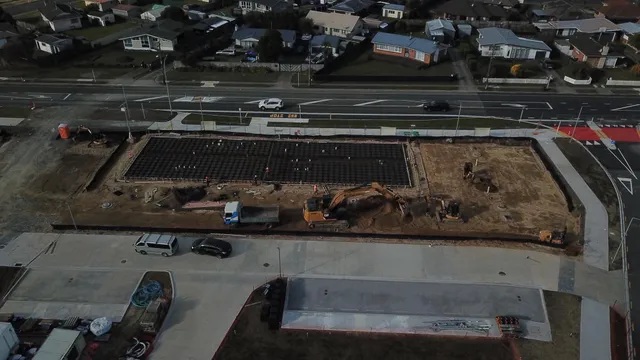 Aerial view of the prepared foundation and construction equipment